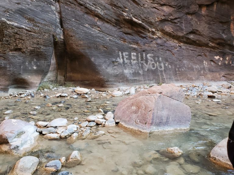“Jesus loves you” is scratched onto the Zion Canyon Narrows