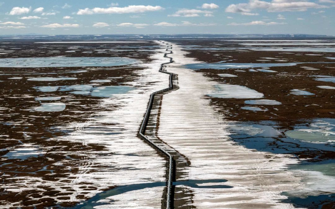 An oil pipeline stretches across the landscape outside Prudhoe Bay in North Slope borough, Alaska